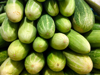 fresh cucumbers in a traditional market