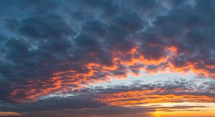 Toned dramatic sky background. Blue gray sky with orange pink clouds. Cloudscape. Fantastic sunset.