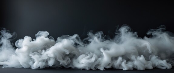 Grey smoke against a black background.