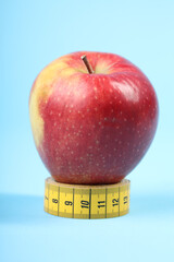 Healthy Lifestyle Concept with Apple and Measuring Tape