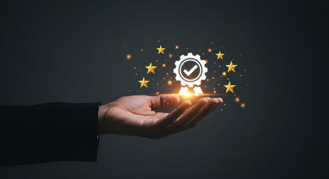 hand presenting a luminous gear and checkmark icon, embodying certification, excellence, and high standards amidst golden sparkles."