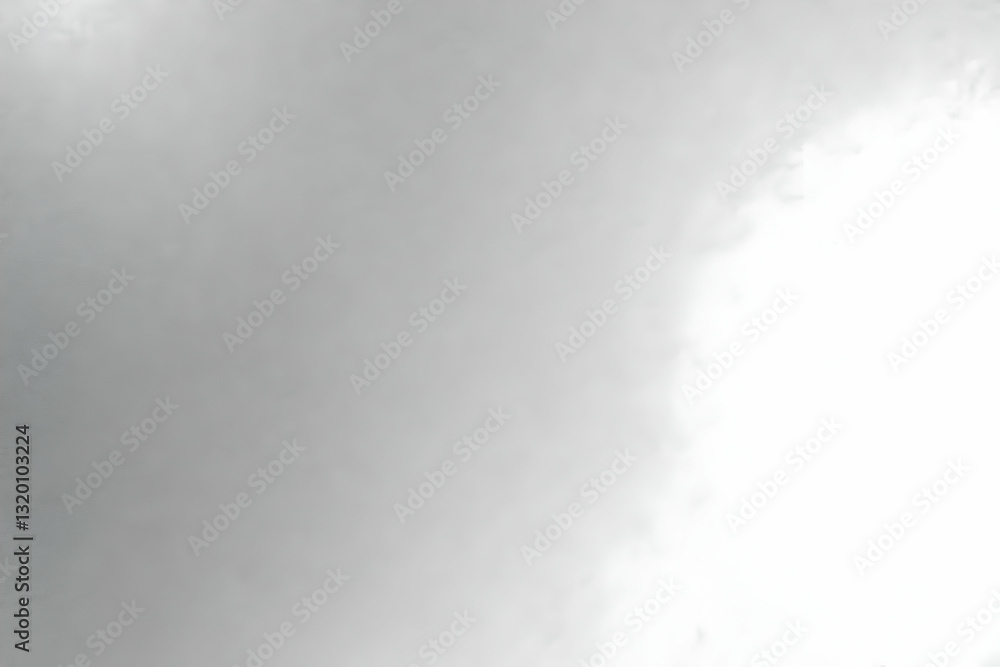 Poster abstract grayscale cloud formation background image showing a blend of dark and light shades, creati