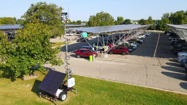 Solar energy powered parking lot and transportable lamp, aerial view