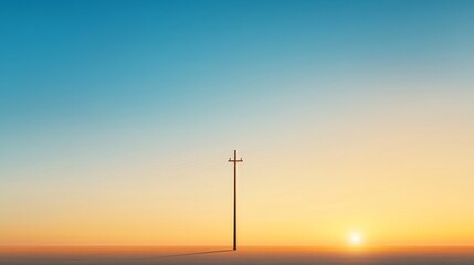 Obraz premium Serene Sunrise Over Horizon with Isolated Power Pole in Landscape