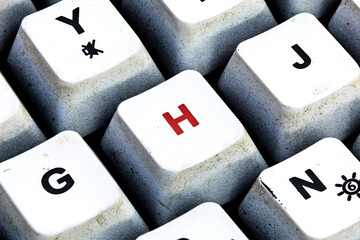 Retro Keyboard with H button in red color. H button keyboard in close up macro