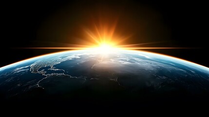 The image shows a sunrise over Earth as seen from space, highlighting the planet's curvature and the glow of city lights against the darkness of space.A brilliant sunrise casts a warm, radiant glow o