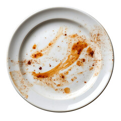 dirty plate with brown sauce stains and spices isolated on black