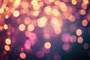 Obraz premium Abstract bokeh lights in shades of golden orange and purple on a dark background