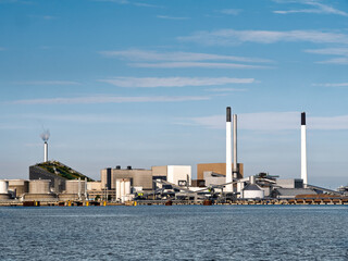 Amagervaerket heat and power station and Amager Bakke waste-to-energy plant with CopenHill ski slope from Oresund, Copenhagen, Denmark