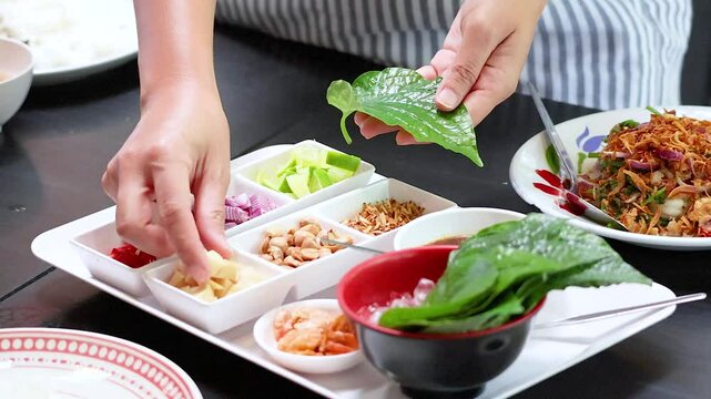 Preparing Miang Kham Savoury Leaf Wraps