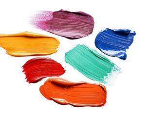 Fototapeta premium Scattered paintbrush strokes in various colors, isolated on white background