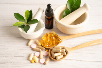 Alternative medicine herbal organic capsule with vitamin E omega 3 fish oil, mineral, drug with herbs leaf natural supplements for healthy good life.