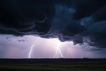 Obraz premium Powerful Lightning Strikes From Dark Storm Clouds Over A Flat Plain As Seen From A Distance