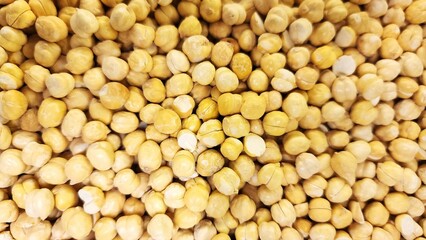 Chickpeas are plants belonging to the Fabaceae family that produce small, yellowish pods.