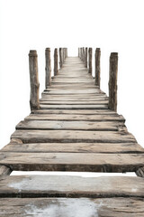 Fototapeta premium A weathered wooden pier extends into a white background, creating an illusion of endlessness and serenity.