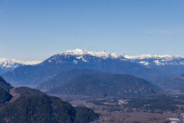 Fototapeta premium Snow-Capped Chief Mountain in Squamish BC Canada with Clear Blue Sky