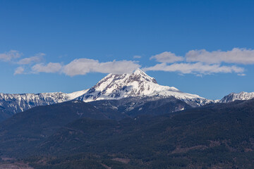 Snow-Capped Chief Mountain in Squamish, BC, Amid Clear Blue Skies
