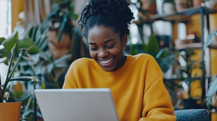 A creative professional using AI to design a startup logo on a computer screen, laying the foundation for a new brand identity.