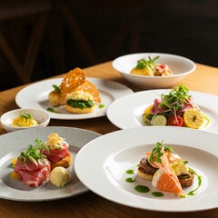 Culinary Arts: An overhead shot of a professionally arranged, top-down view of multiple courses. Plating, each with a diverse range of components, showcasing various textures and flavors.