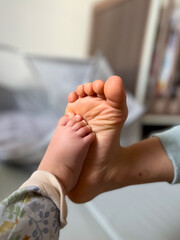 Baby and Parent Feet Together