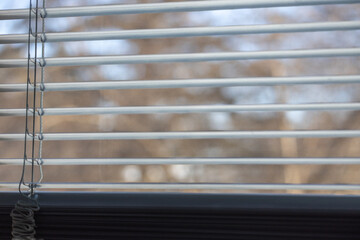 Macro abstract texture background of mini blinds slats on a window with defocused background