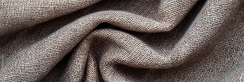 Poster a close-up view of textured fabric, showcasing its intricate weave and natural tones in a soft and f