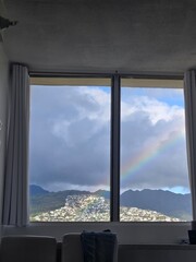 Imagine looking out of a window, where the sky is painted with a stunning rainbow