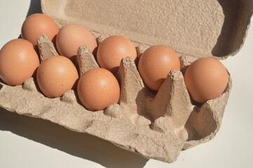 a carton of eggs, a box of eggs, tray of eggs. Conceptual photo of the rising price of eggs, egg...