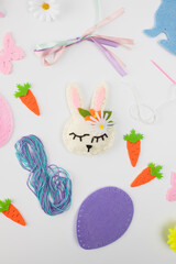 Handmade easter bunny craft with felt and ribbon for diy decoration. Easter gift