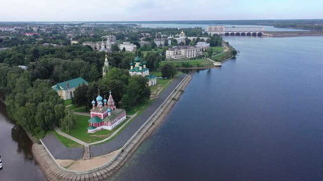 Picturesque aerial view of modern townscape of Uglich overlooking dam on Volga River on summer day, Yaroslavl region, Russia. High quality 4k footage