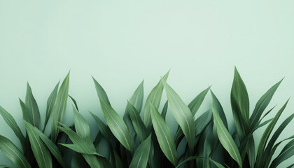 Vibrant green leaves against a soft pastel background.