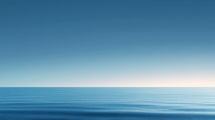 Obraz premium 47.A peaceful, expansive horizontal view of a calm blue ocean under a cloudless sky at sunset, with extreme long exposure capturing the smooth, blurred motion of the sea, enhancing the tranquility of