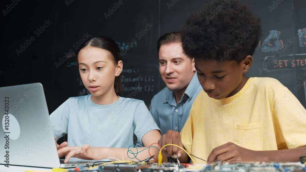 Poster caucasian teacher pointing at laptop while teaching about engineering code. instructor working by us