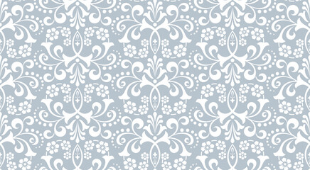 Wallpaper in the style of Baroque. White and gray floral ornament. Seamless vector background. Graphic pattern for fabric, wallpaper, packaging. Ornate Damask flower illustration