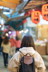 woman traveler visiting in Taiwan, female Tourist with backpack sightseeing and shopping at Jiufen...