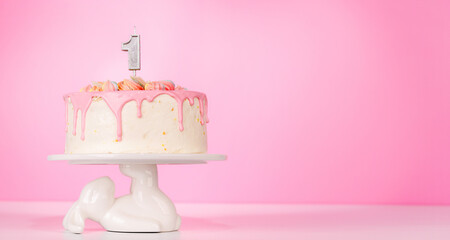A festive birthday cake topped with candle