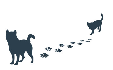 足跡をつけながら歩く犬と猫のシルエット