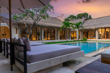 Balenese Pool Villa in Seminyak on the beautiful island of Bali colourful skies lush green tress Bali Indonesia