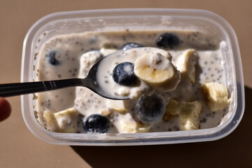a healthy breakfast of overnight oats with milk, A bowl of overnight oats