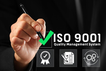 QMS, ISO 9001 Quality Management System concept. Certified and quality management of organizations Businessman using smartphone to choose ISO 9001 on virtual screen