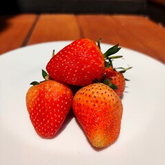 Fresh Strawberries on a White Plate