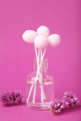 Air freshener on pink. White aroma diffuser bottle with sticks. Minimalism. Top view