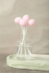 Air freshener on grey. White aroma diffuser bottle with sticks. Minimalism. Top view