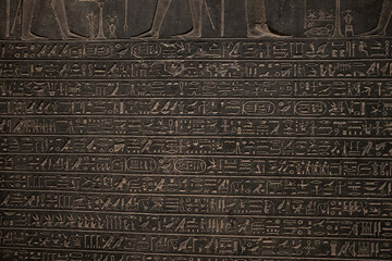 ancient Egyptian carvings and hieroglyphs on sand stones at the Grand Egyptian Museum in Cairo,...