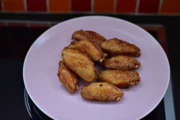 delicious crispy chicken wings arranged, Fried chicken wings in frying pan, Crispy Fried Chicken with Fish Sauce