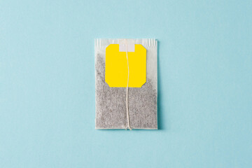 Top view of tea bag on blue background