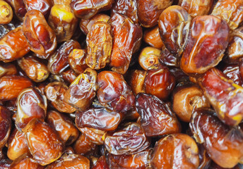 Close-up of Kurma, appetizing honey dried date palm fruits. Popular during Ramadan