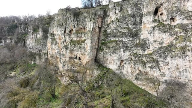 The rock monastery Shan Kaya near the village of Onogur, northeastern Bulgaria. It is located in the sheer cliffs on the left bank of the dry riverbed of Suha Reka.