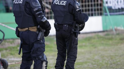Heavy armed police officers. During a football game 