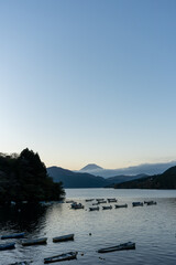 Mt. Fuji and small boats on lake Ashi at Sunset, Hakone, Japan